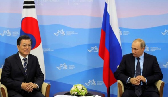 Russian President Vladimir Putin and his South Korean counterpart Moon Jae-in attend a meeting during the Eastern Economic Forum in Vladivostok